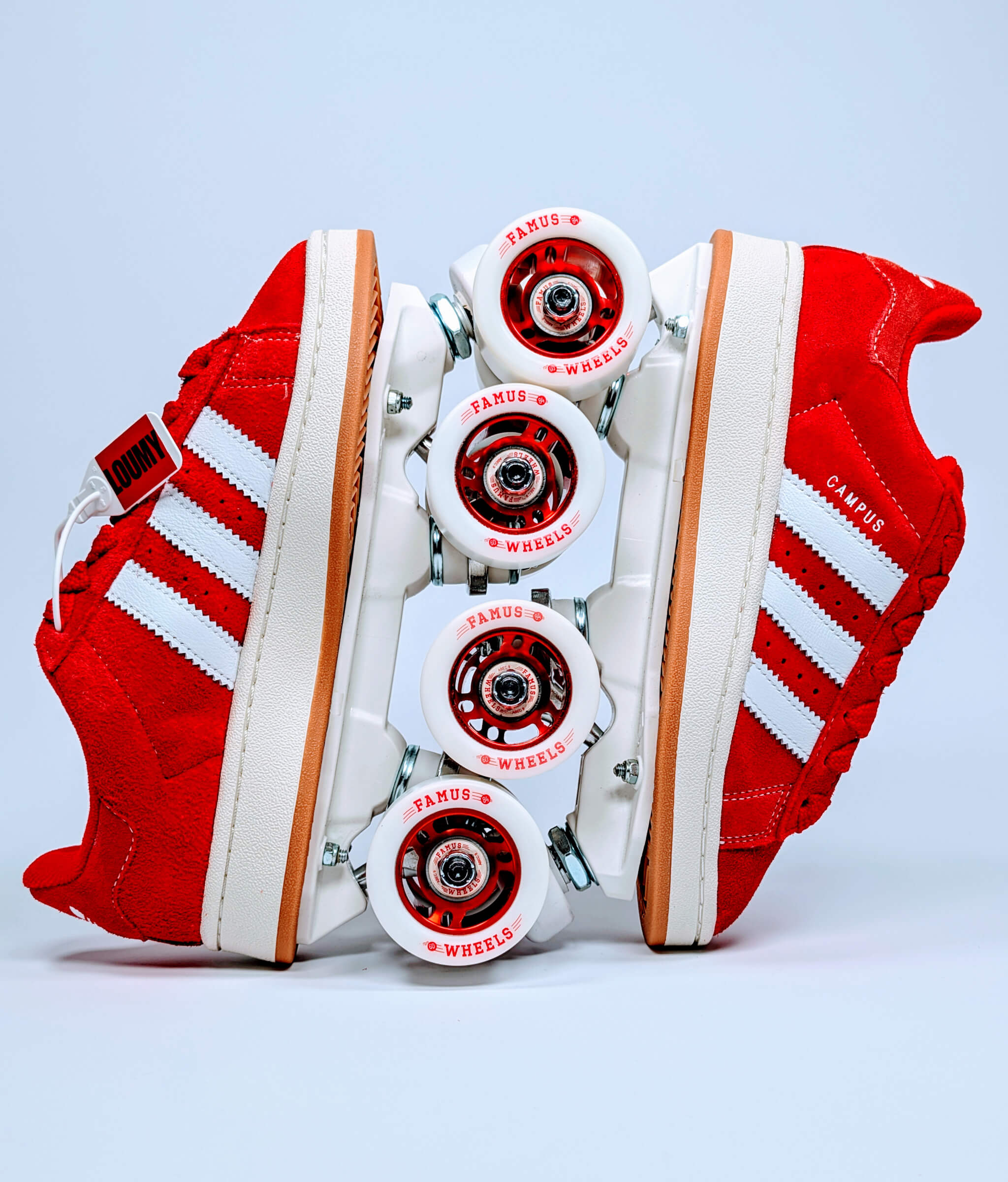 Red Adidas Campus roller sneakers by Loumy displayed vertically with interlocked wheels and red metallic rims