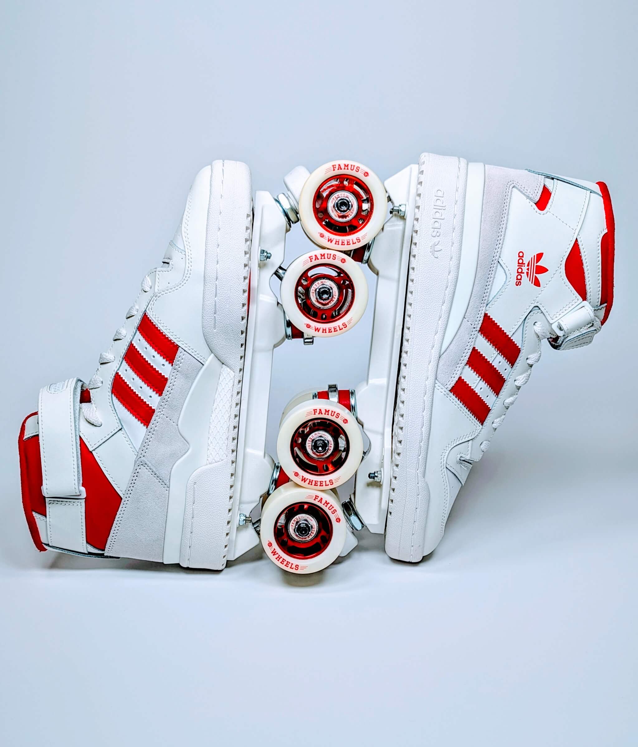 Adidas Forum Redline roller sneakers by Loumy in red and white, displayed with interlocked wheels and metallic rims