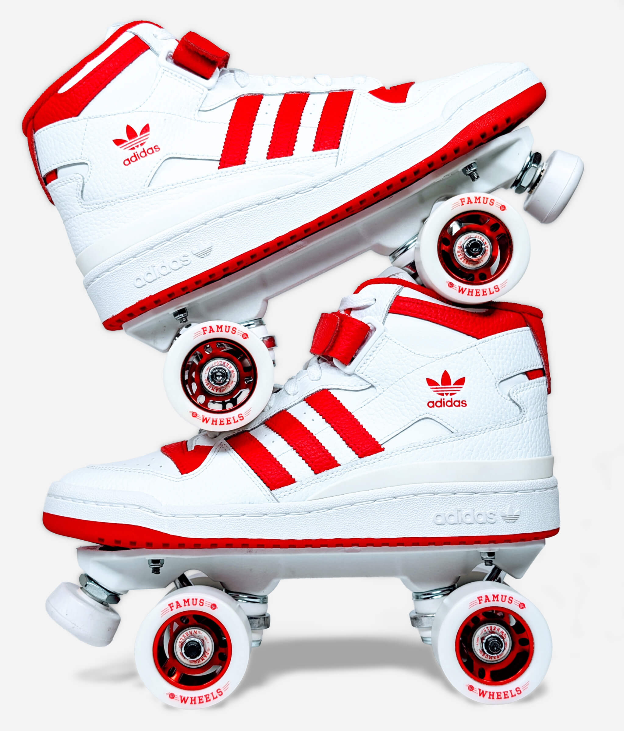 Side view of Loumy's Adidas Forum roller skate sneakers stacked one over the other, white and red with metallic hubs