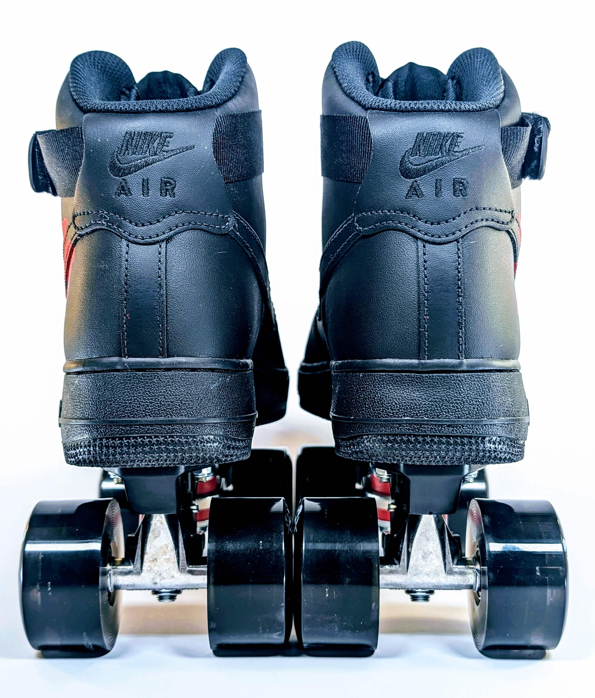 Back view of Loumy x Kazy’s custom black Nike Air Force 1 High Akira roller sneakers
