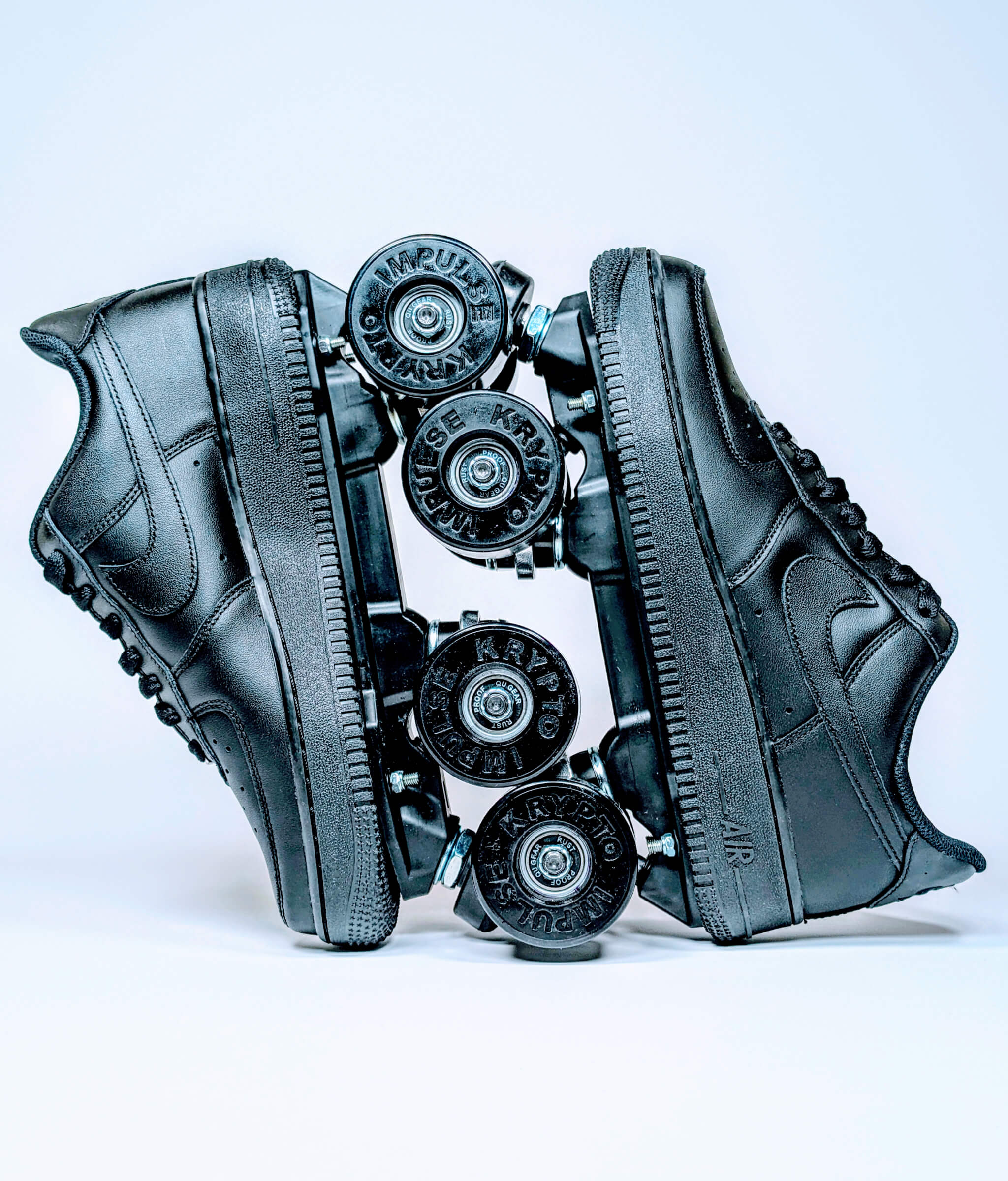 Loumy's Nike Air Force 1 Low roller sneakers in all black, displayed vertically with interlocked wheels