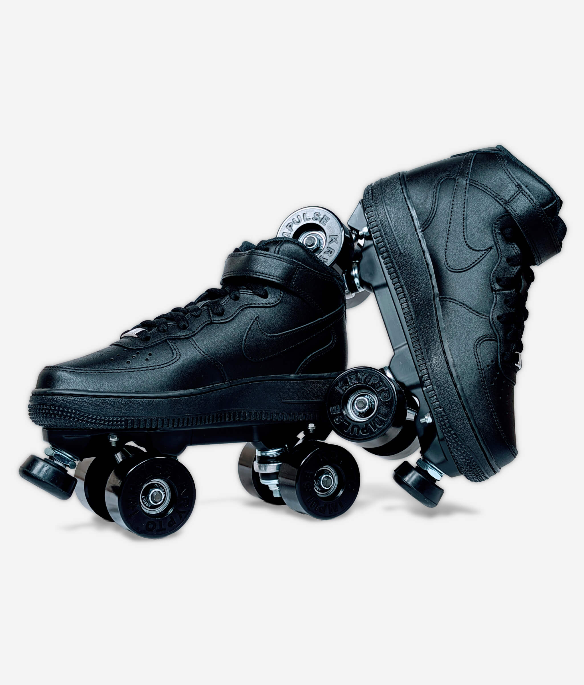 Loumy roller skate sneakers made from all black Nike Air Force 1 Mid, with one tilted and balanced on the other