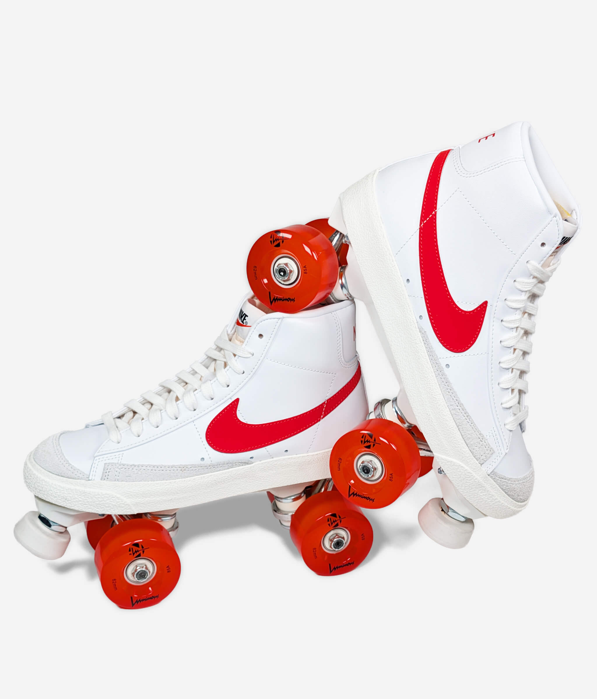Nike Blazer Habanero roller skate sneakers by Loumy's World in white and orange, with one tilted roller skate balanced on the other