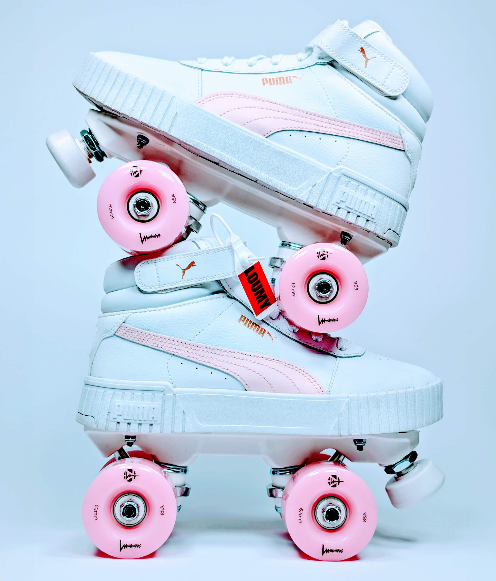 Side profile of Loumy's Puma Carina roller sneakers stacked one over the other