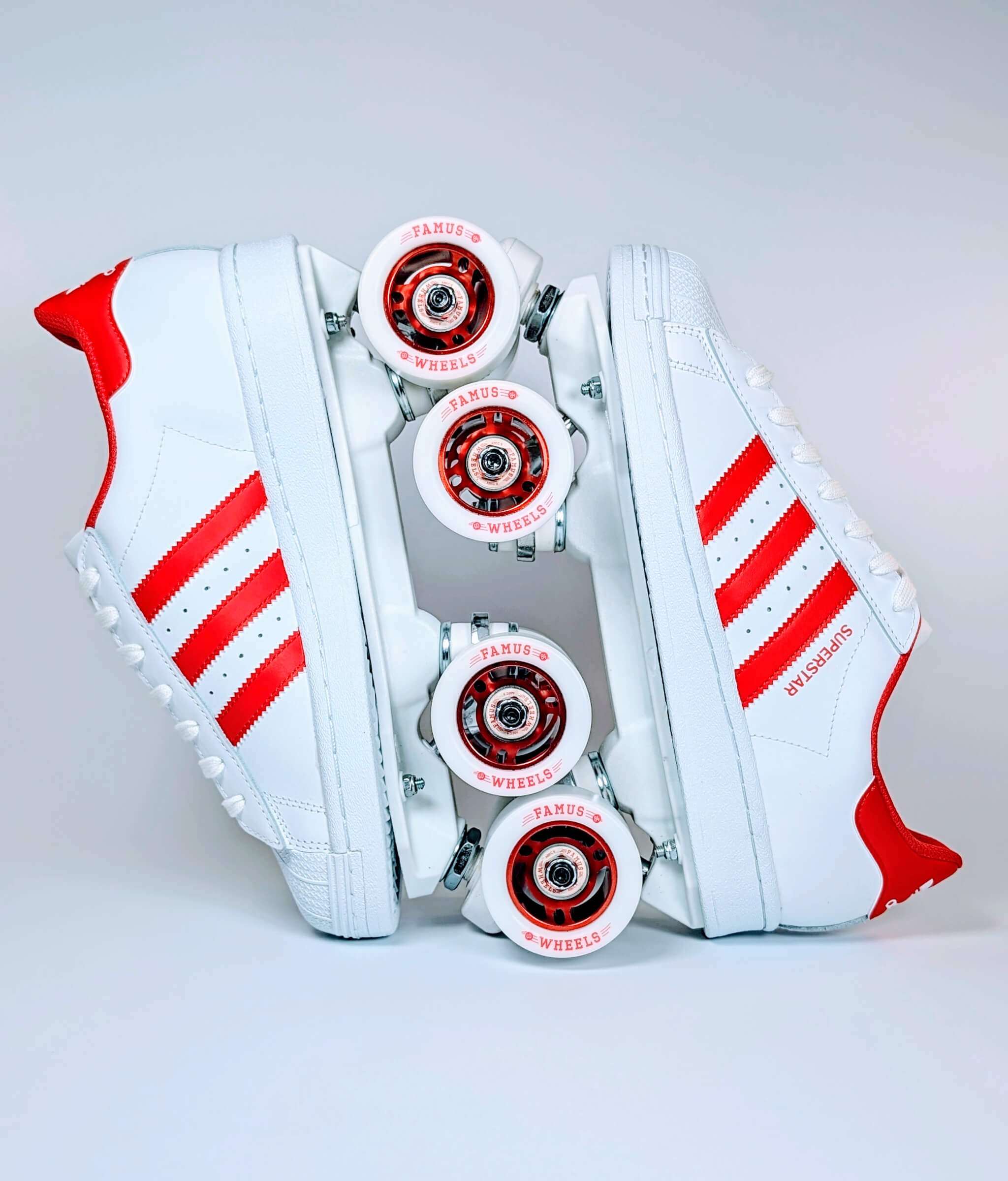 Loumy’s Adidas Superstar roller sneakers in white and red with interlocked wheels