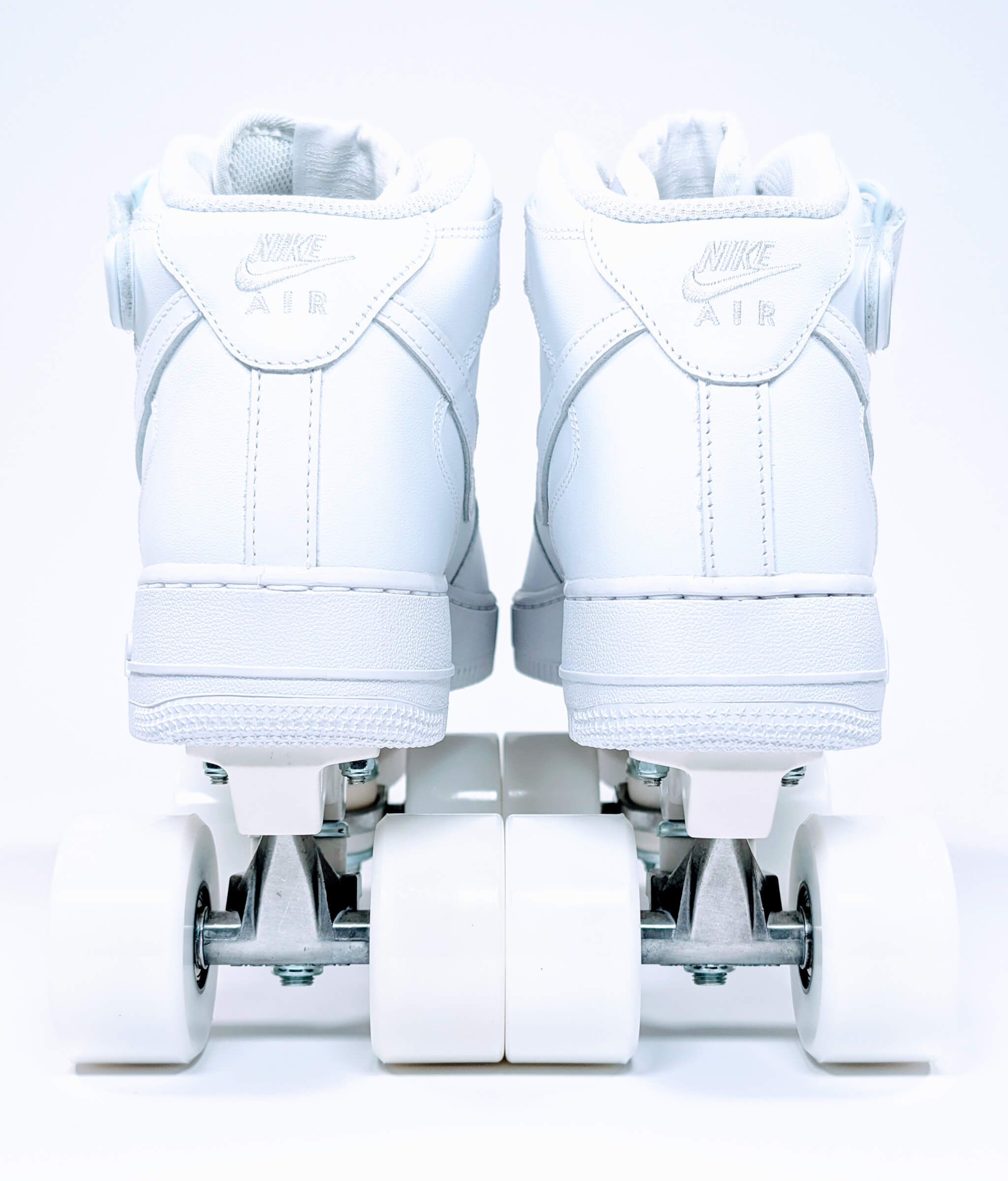 Back view of Loumy's Nike Air Force 1 Mid roller sneakers in white