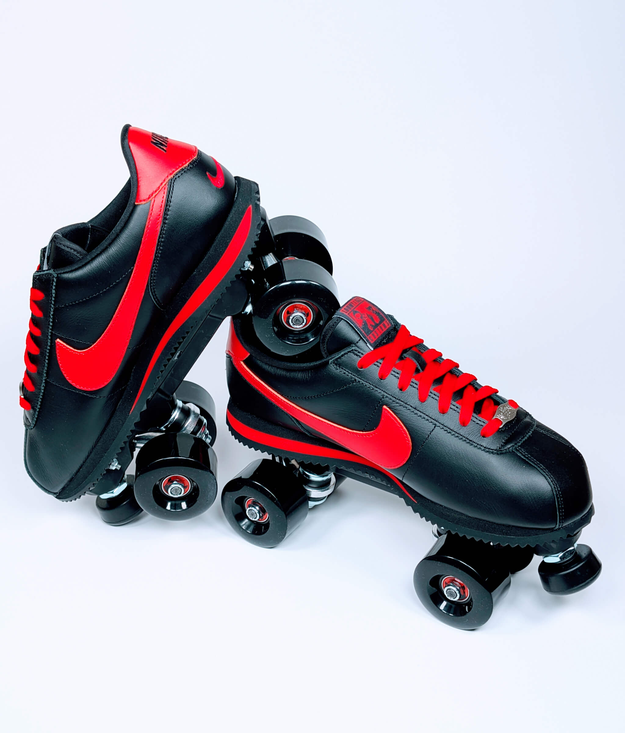 Tilted Nike Cortez roller sneaker balanced on the other, custom-built by Loumy x Kazy with high-performance design