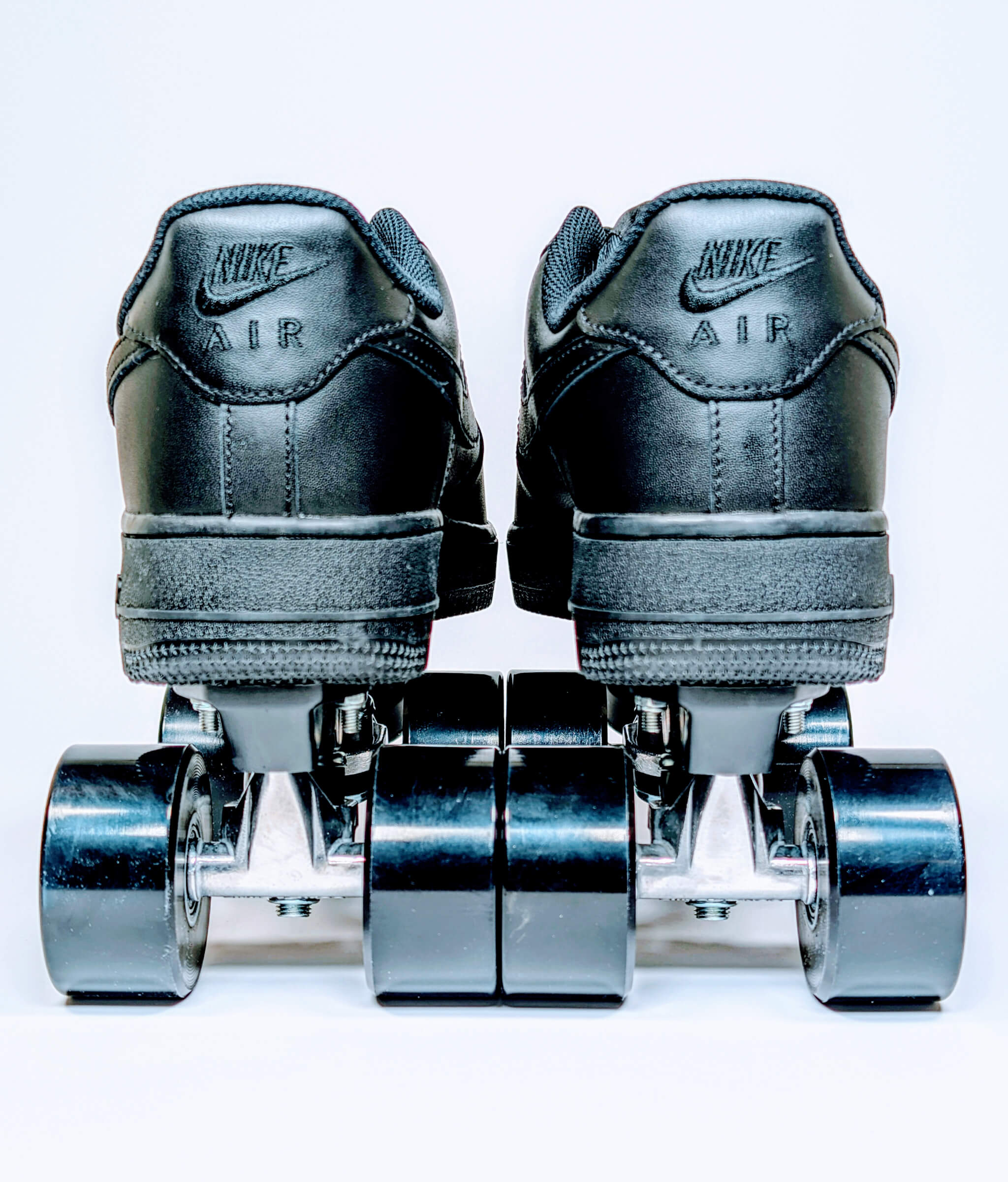 Back view of Loumy's Nike Air Force 1 Low roller sneakers in all black