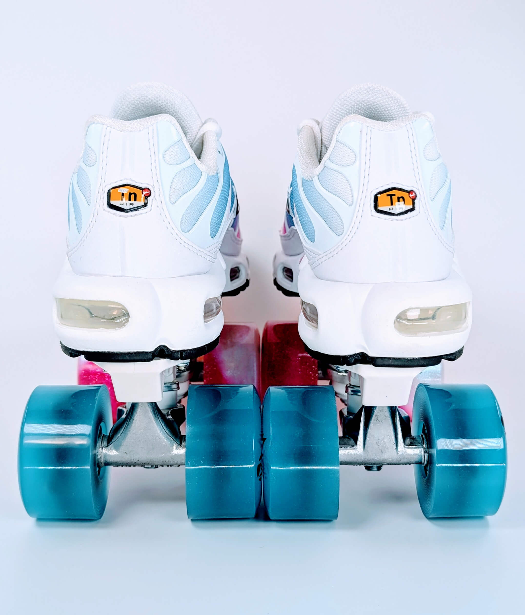 Back view of Loumy's Air Max Plus Summer Gradient roller sneakers with rear blue LED wheels and visible air cushioning