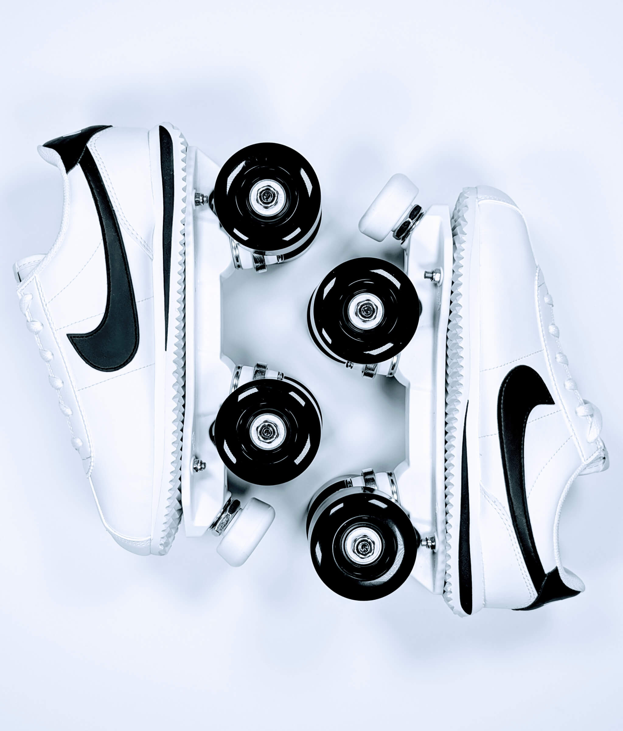 Nike Cortez roller sneakers by Loumy, placed in mirrored position in black and white
