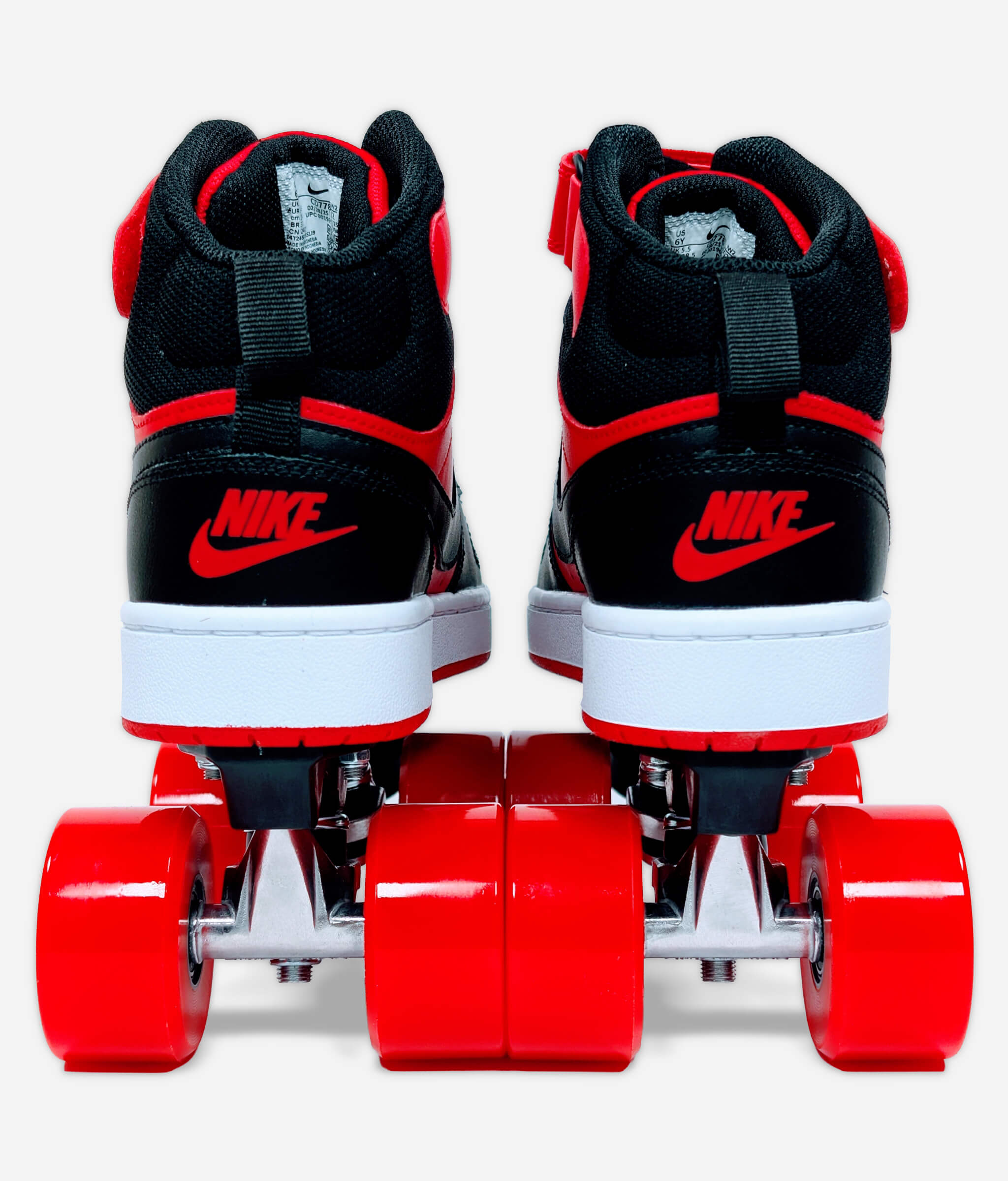 Back view of Loumy’s Nike Court Borough roller skate sneakers in red and black with red Nike logo