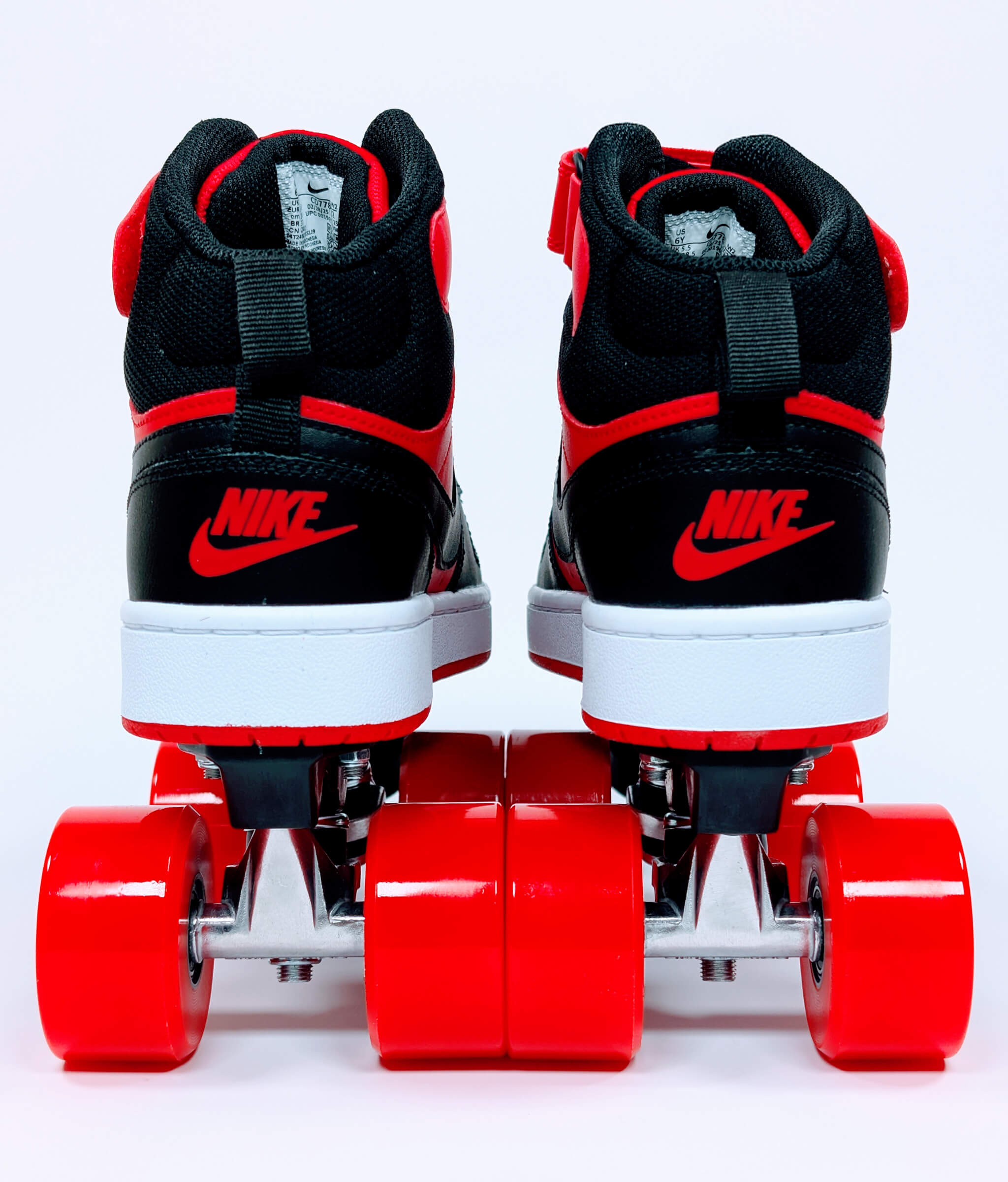 Back view of Loumy’s Nike Court Borough roller sneakers in red and black with red Nike logo