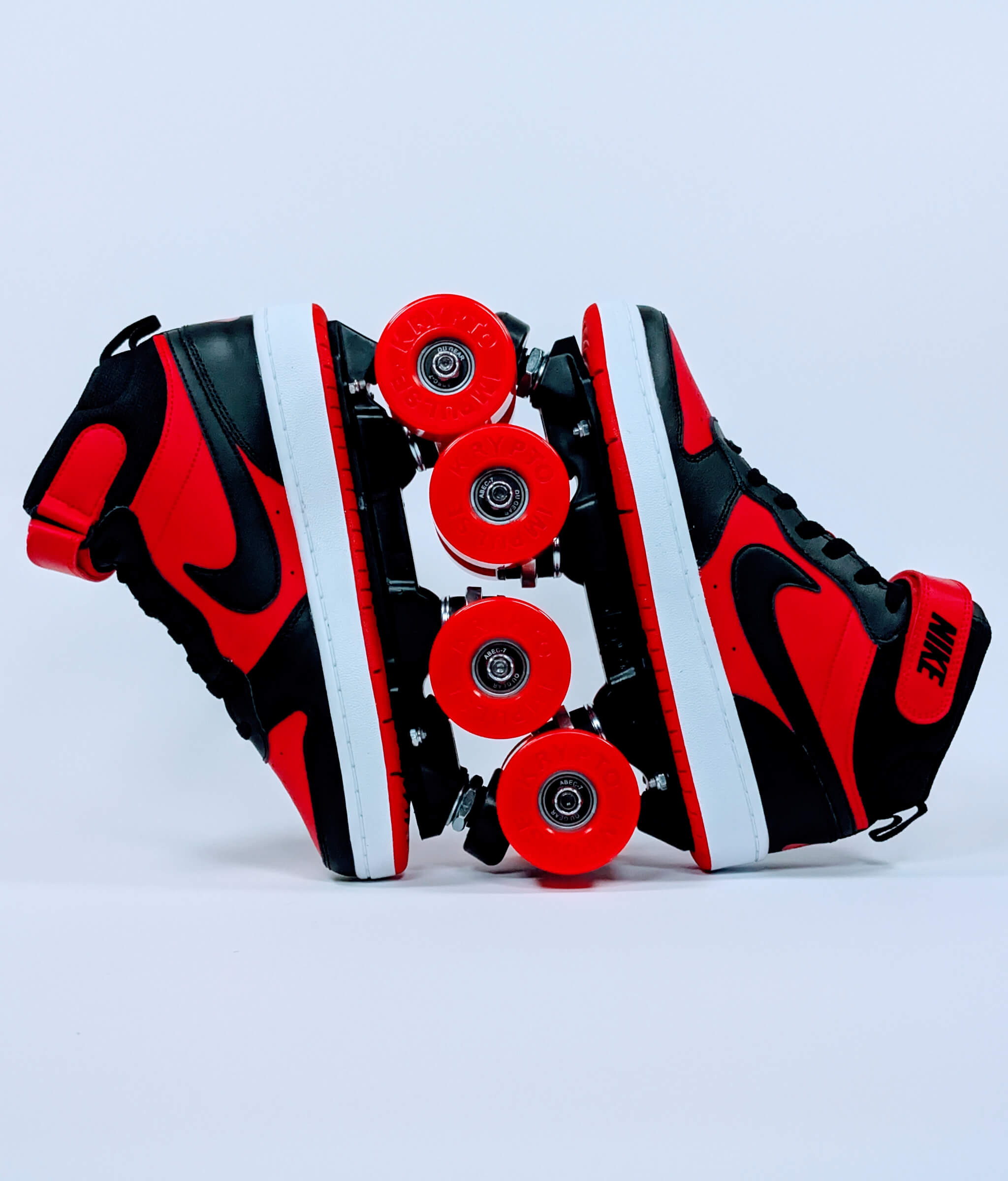 Loumy’s Nike Court Borough roller sneakers in red and black with interlocked wheels