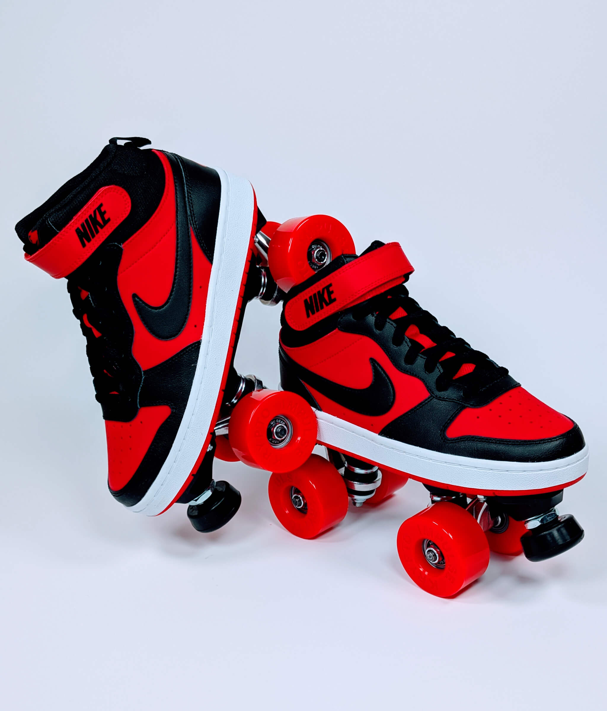 Loumy’s Nike Court Borough roller sneakers in red and black in a tilted view