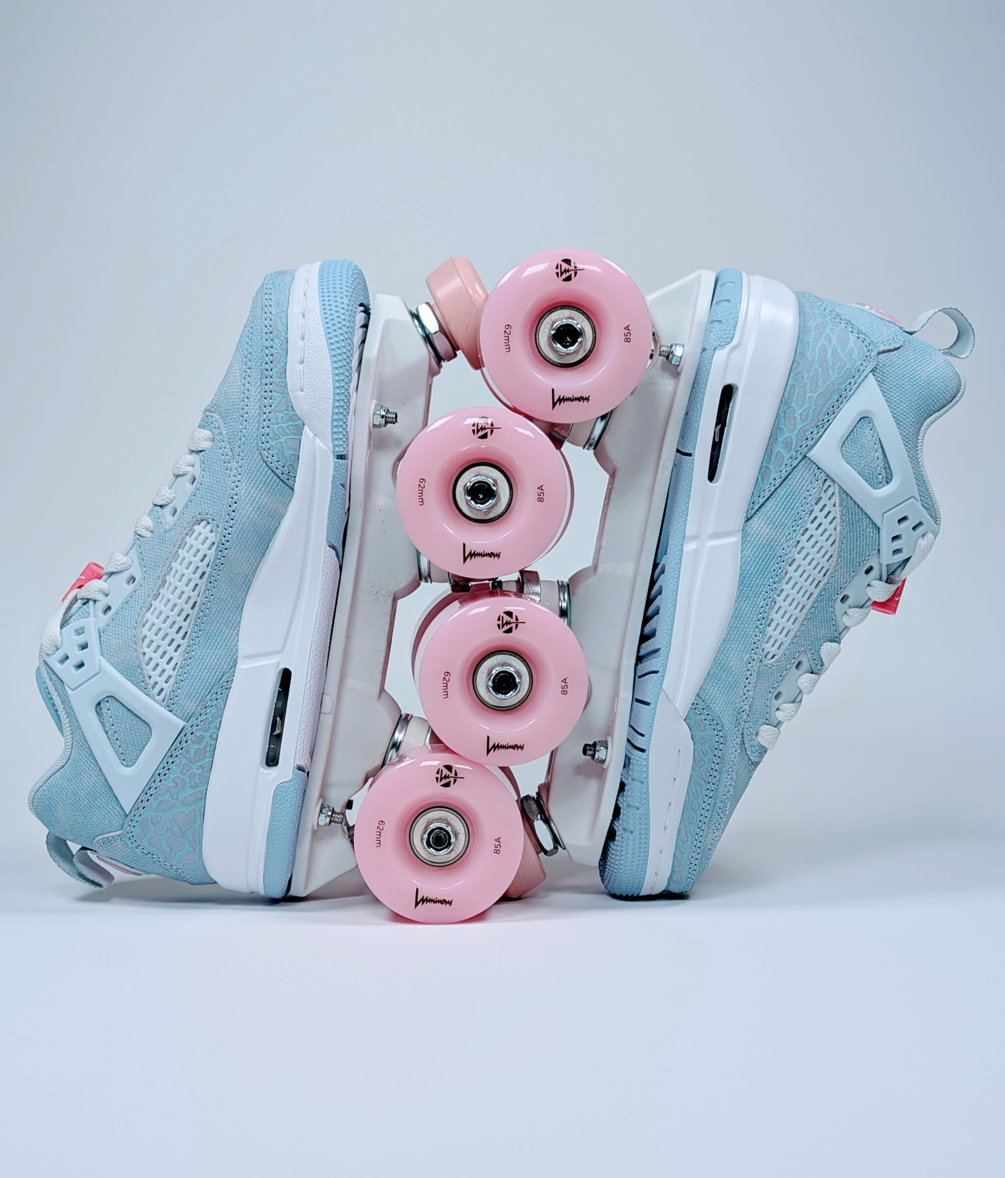 Loumy roller sneakers made from blue Nike Jordan Spizike, displayed vertically with interlocked wheels