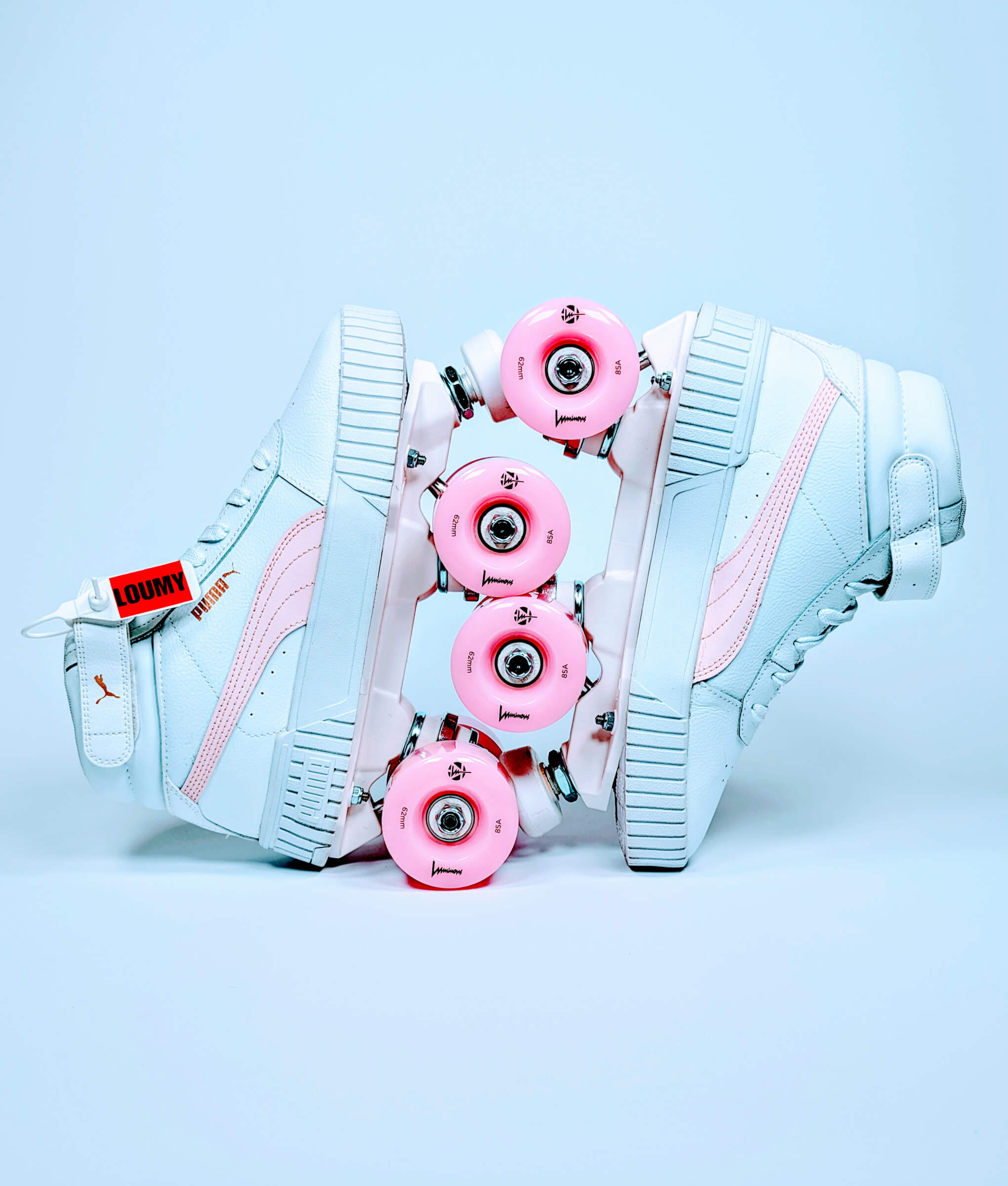 Loumy's Puma Carina roller sneakers displayed vertically with interlocked wheels