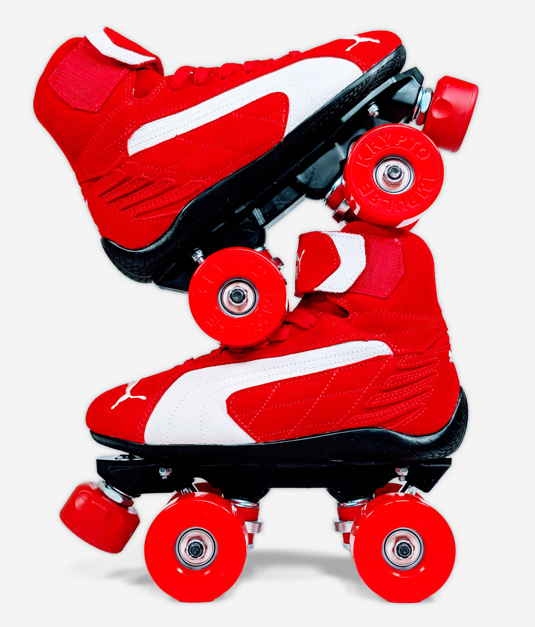 Side view of Loumy's Puma Speedcat Mid roller skate sneakers stacked one over the other, red and black