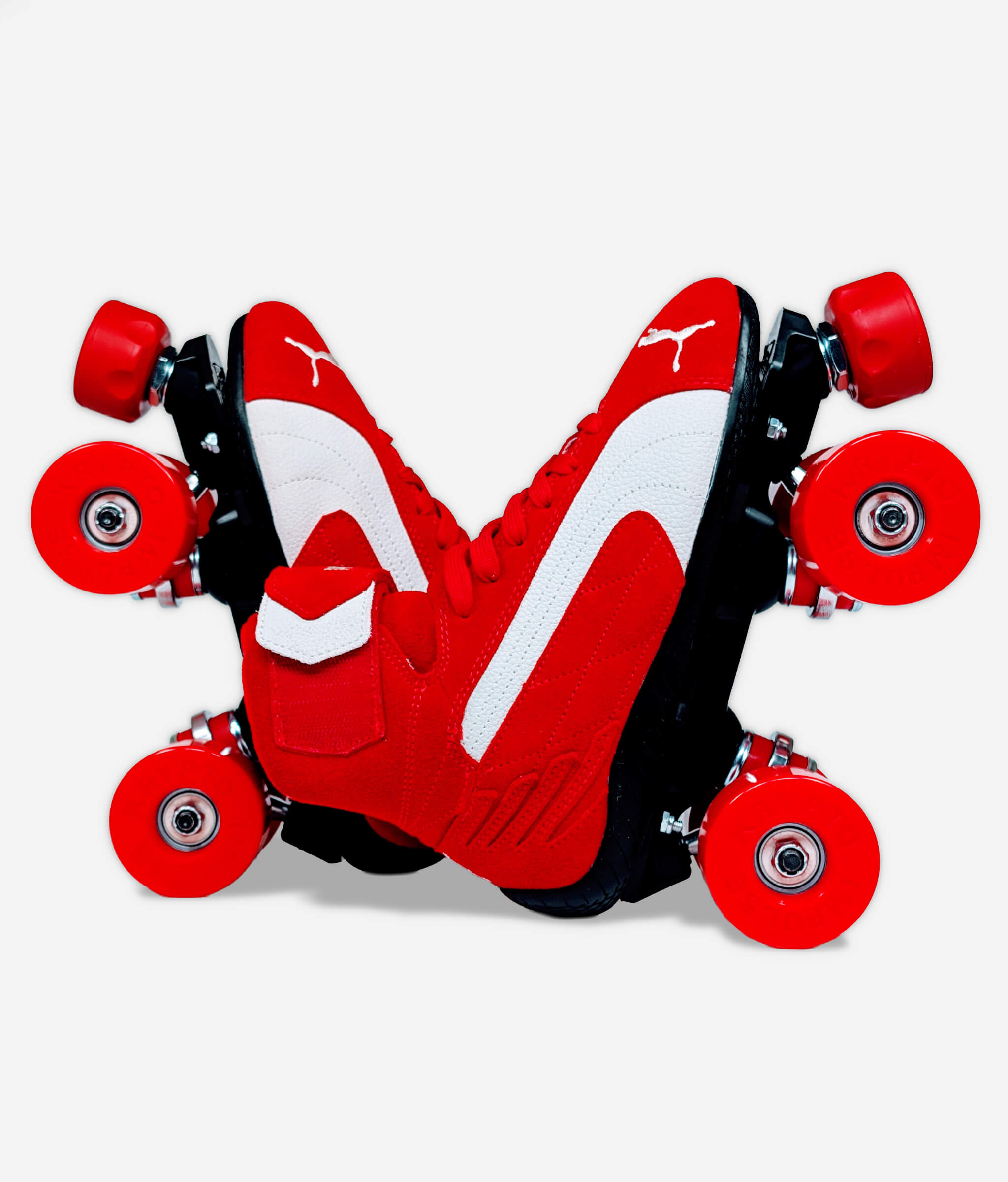 Puma Speedcat Mid roller skate sneakers by Loumy in red and black, arranged in a V-shape