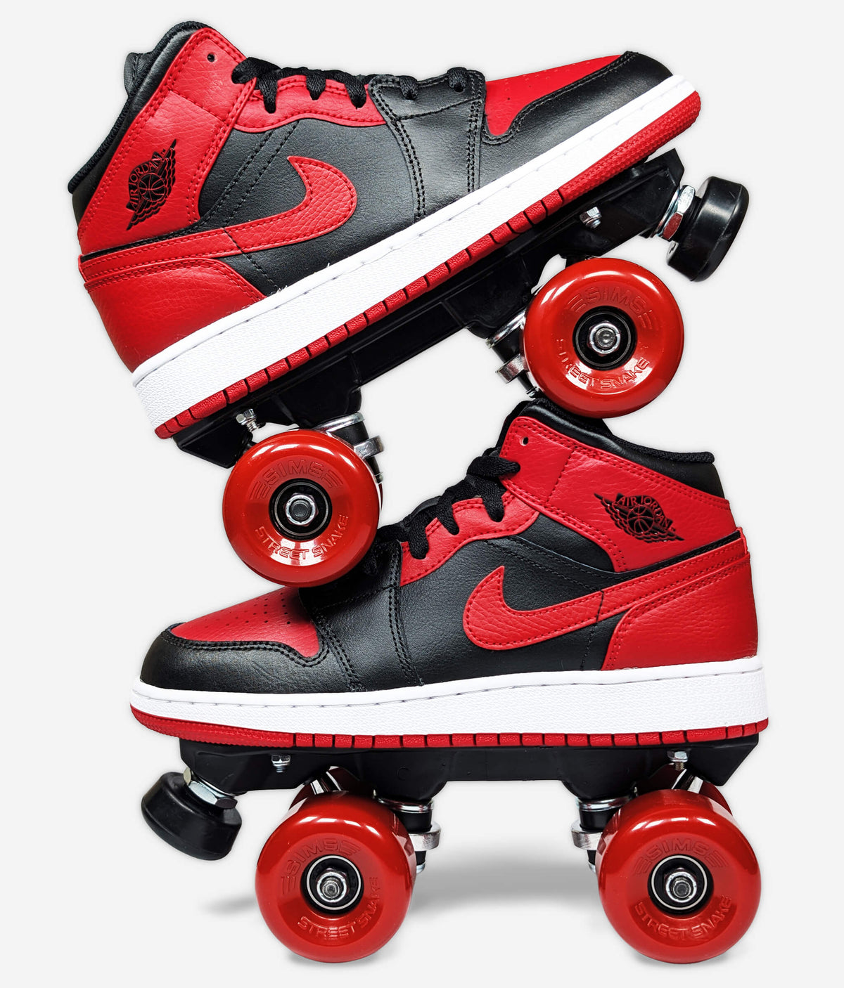 Black and red Nike Air Jordan Banned 2020 roller skate sneakers by Loumy’s World, stacked in opposite directions.